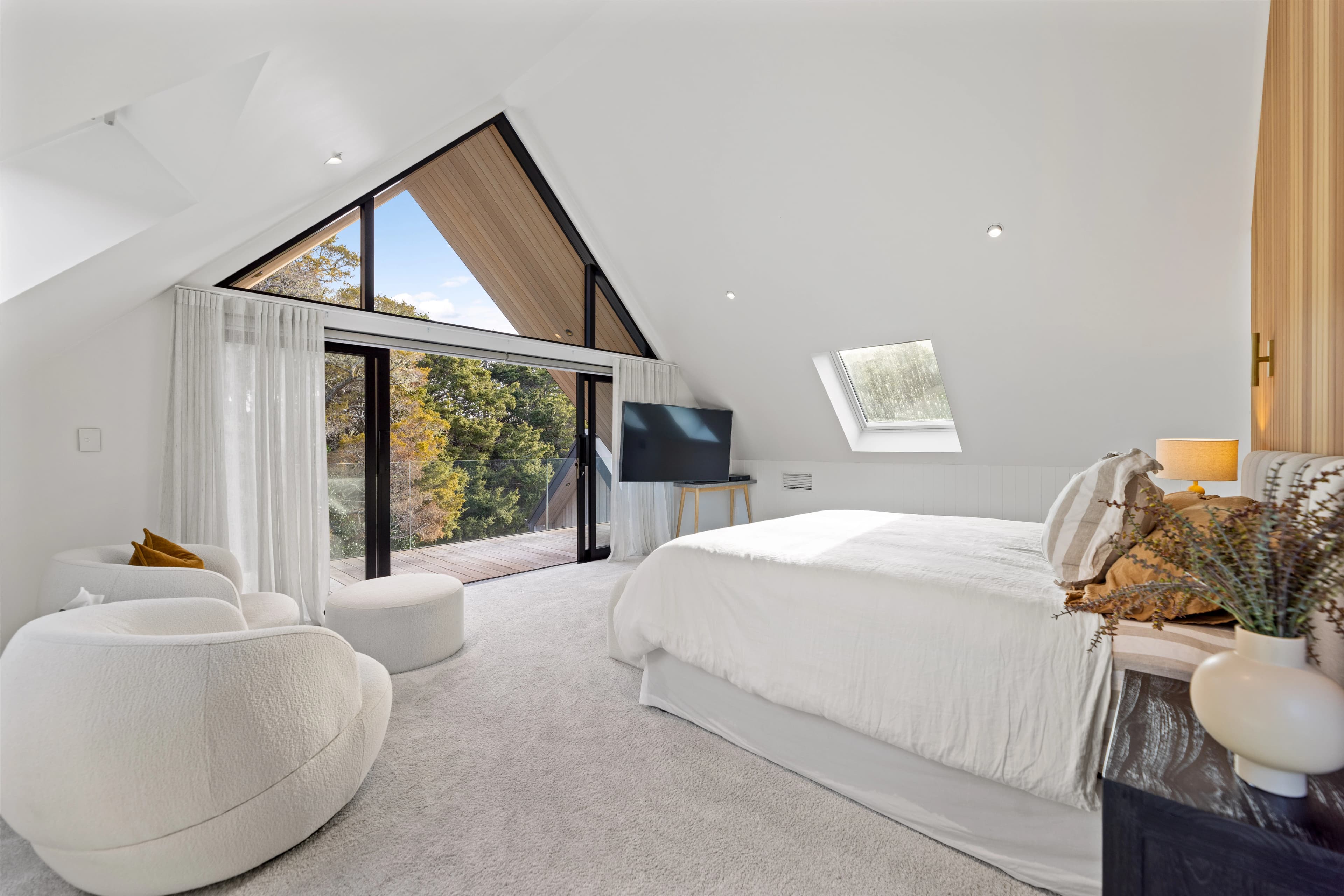 Warm bedroom interior with natural light and timber detailing